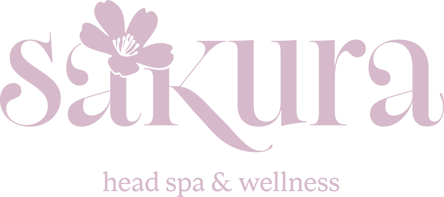logo in an elegant style, with the text "sakura head spa & wellness" in light pink colours on a solid background.